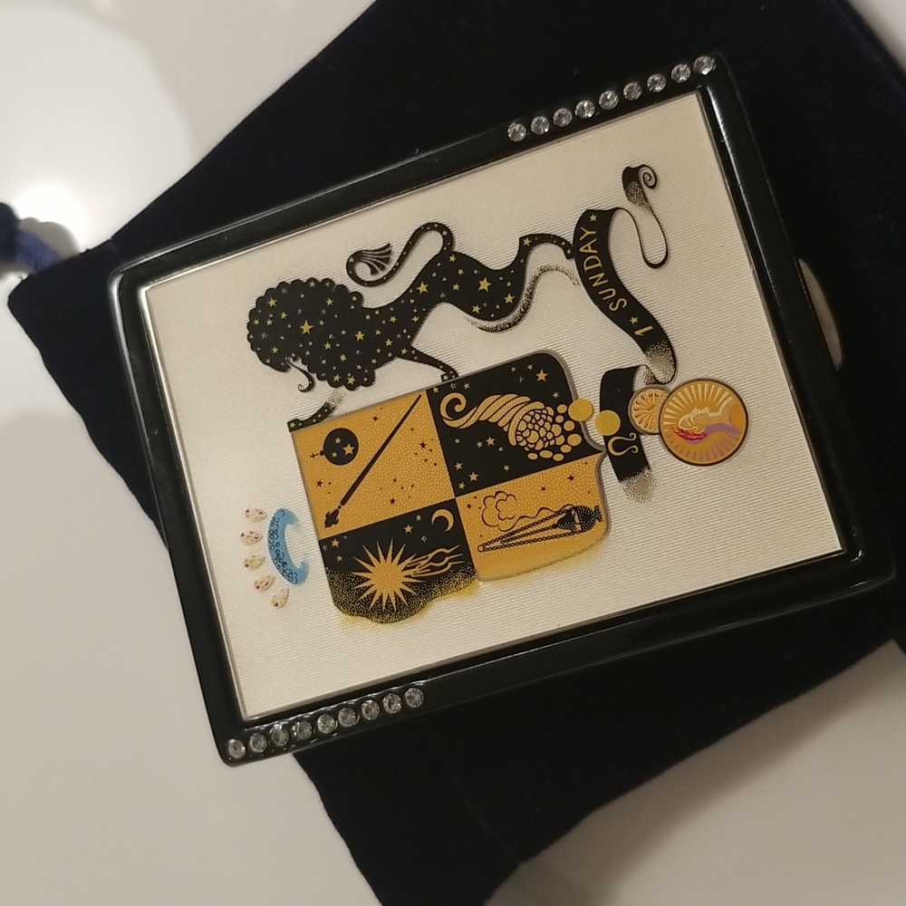 Estee Lauder Collectible compact for solid perfumes and pressed powder.